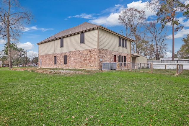 view of property exterior with a yard and central AC