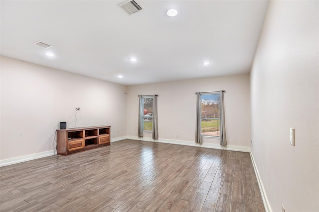 unfurnished living room featuring light wood-type flooring