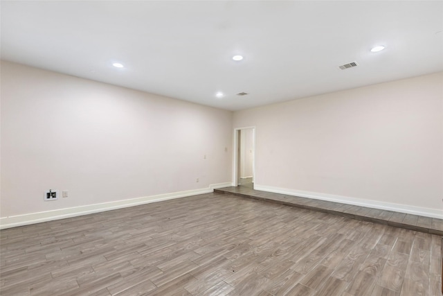 unfurnished room featuring light hardwood / wood-style flooring