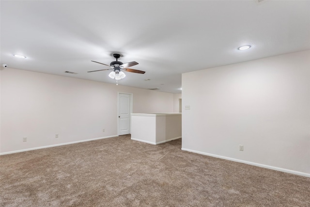 unfurnished room featuring carpet flooring and ceiling fan