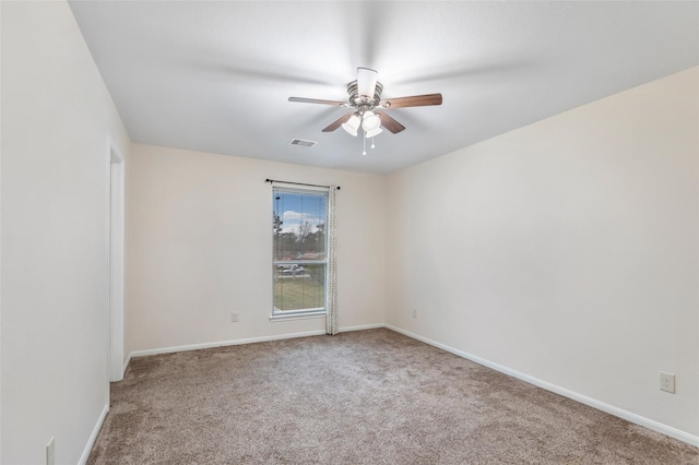 empty room with ceiling fan and carpet