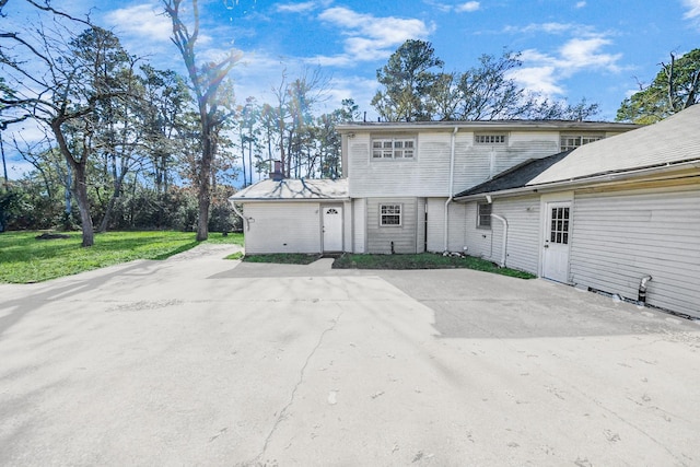 rear view of property with a yard