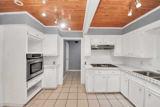 kitchen featuring white cabinetry, light tile patterned floors, wooden ceiling, and appliances with stainless steel finishes