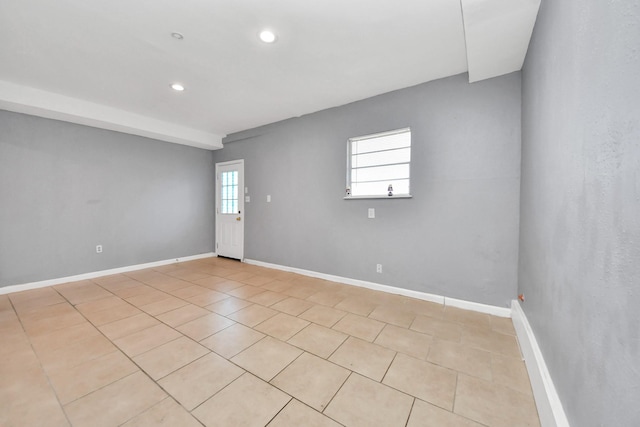 tiled empty room with plenty of natural light