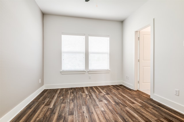 empty room featuring dark hardwood / wood-style flooring