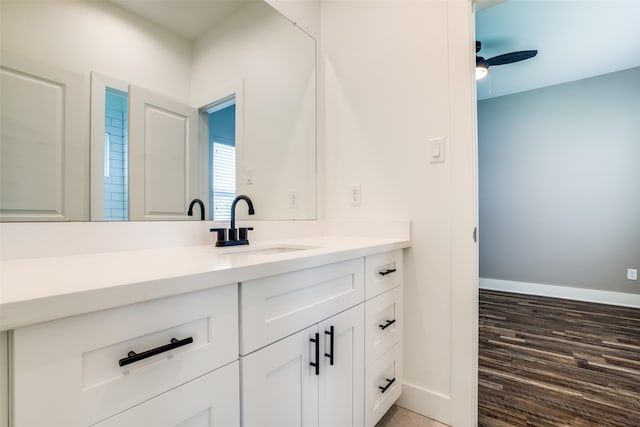 bathroom featuring hardwood / wood-style floors, vanity, and ceiling fan