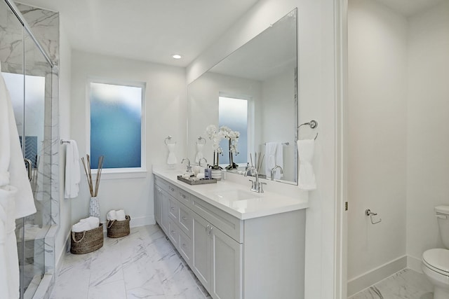 bathroom featuring walk in shower, vanity, and toilet