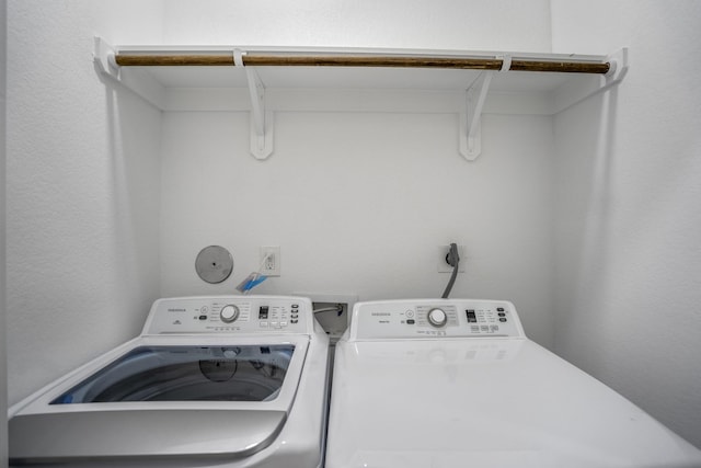 washroom with separate washer and dryer