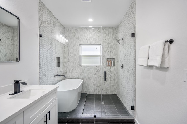 bathroom with separate shower and tub, tile patterned flooring, and vanity