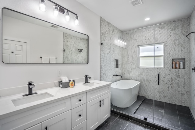 bathroom with tile patterned flooring, vanity, and independent shower and bath