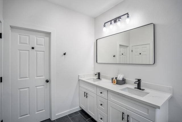 bathroom with tile patterned floors and vanity