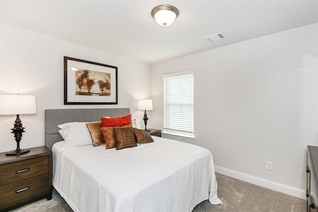 bedroom with light carpet