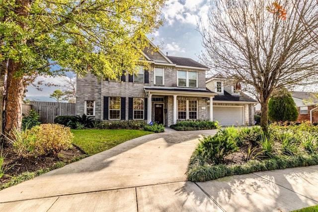 view of front of house with a garage and a front lawn