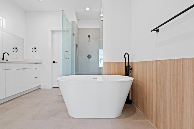 bathroom featuring vanity, separate shower and tub, and wood walls