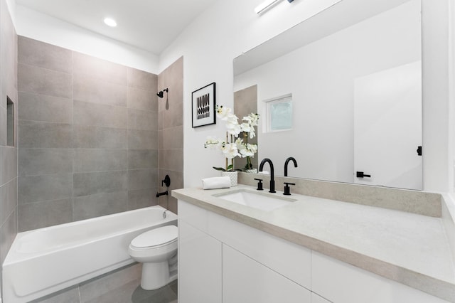 full bathroom with vanity, tiled shower / bath combo, toilet, and tile patterned flooring