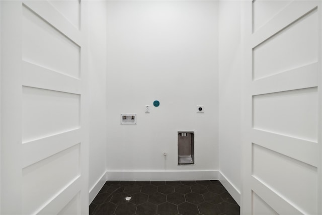 laundry area featuring hookup for a gas dryer, laundry area, washer hookup, baseboards, and electric dryer hookup