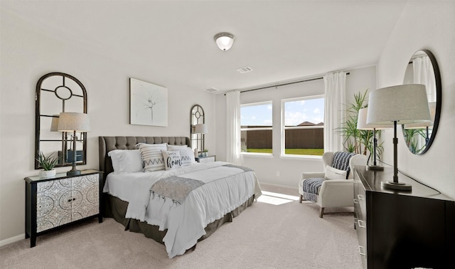 bedroom featuring light carpet