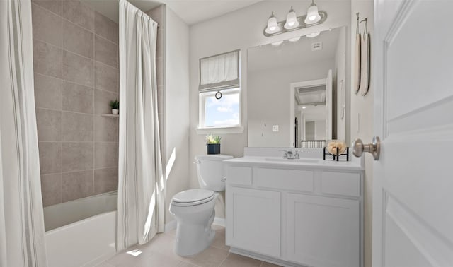 full bathroom with tile patterned flooring, vanity, shower / tub combo, and toilet