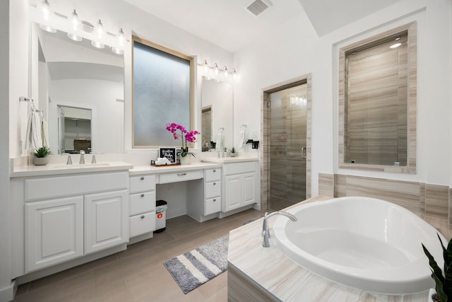 bathroom featuring tile patterned flooring, vanity, and independent shower and bath