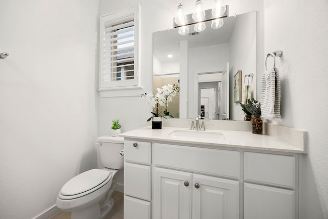 bathroom featuring vanity, toilet, and curtained shower