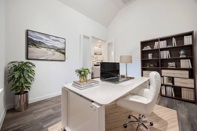 office space featuring high vaulted ceiling, ceiling fan, and dark wood-type flooring