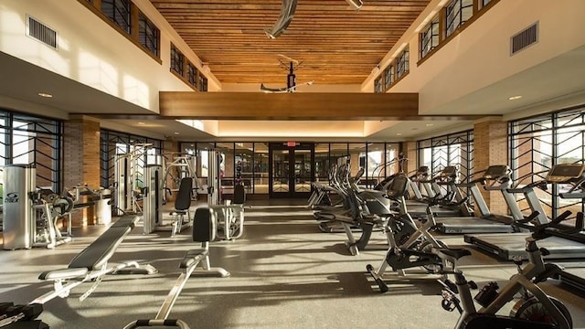 exercise room with a high ceiling