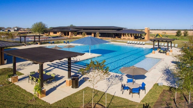 view of pool with a patio area and a pergola