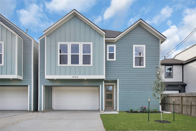 view of front facade featuring a front yard and a garage