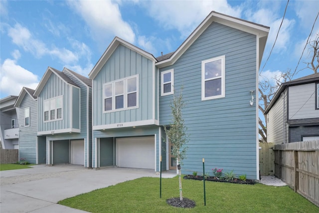 view of front of property with a garage and a front yard