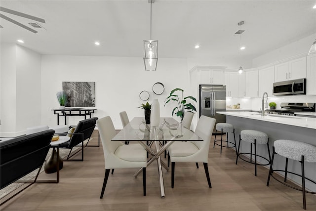 dining space featuring light hardwood / wood-style flooring