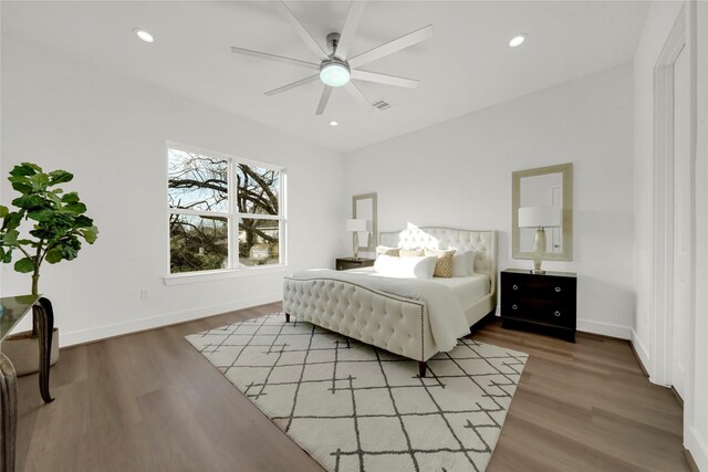 bedroom with hardwood / wood-style floors and ceiling fan