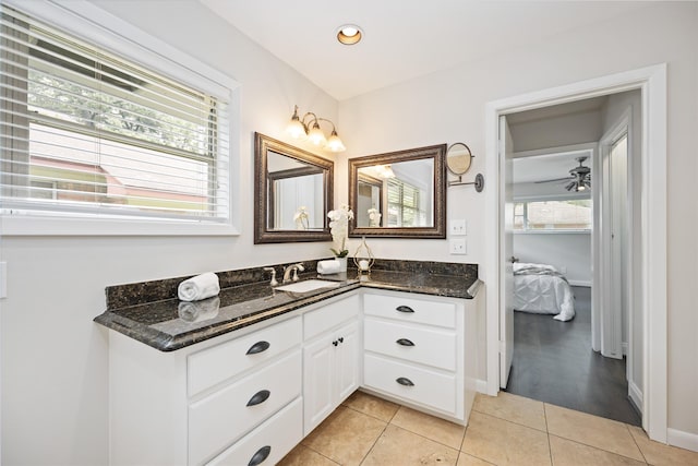 bathroom featuring ceiling fan, tile patterned flooring, and vanity