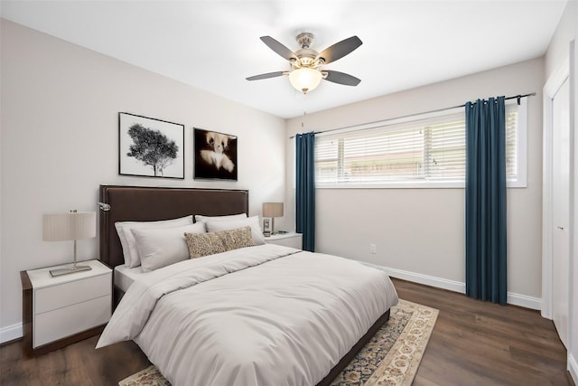 bedroom featuring ceiling fan and dark wood-type flooring