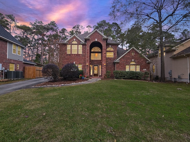 view of property featuring a lawn