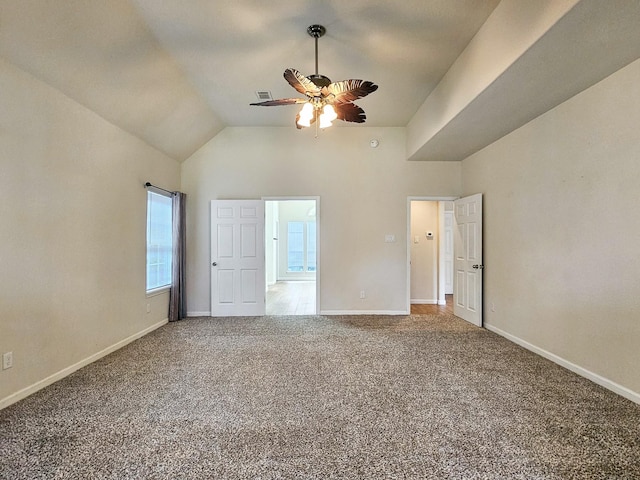 unfurnished bedroom featuring ceiling fan, carpet, and vaulted ceiling