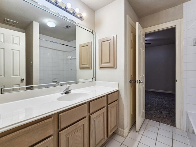 bathroom with tile patterned flooring and vanity