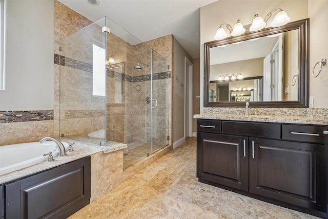 bathroom featuring vanity and shower with separate bathtub