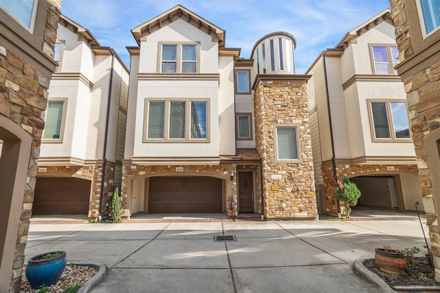 multi unit property featuring a garage