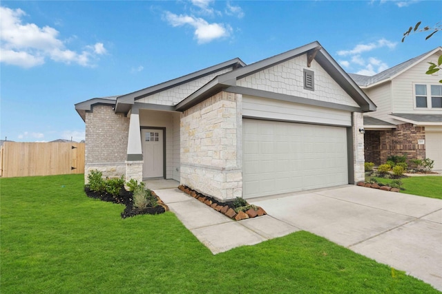 view of front of property featuring a front yard and a garage