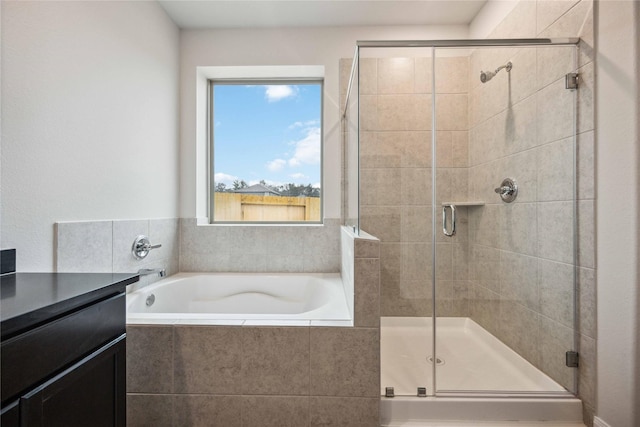 bathroom featuring separate shower and tub