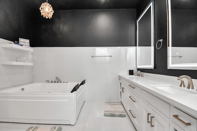 bathroom featuring tile patterned flooring, vanity, and a washtub