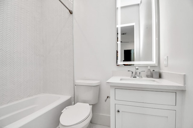 full bathroom featuring tiled shower / bath, vanity, and toilet