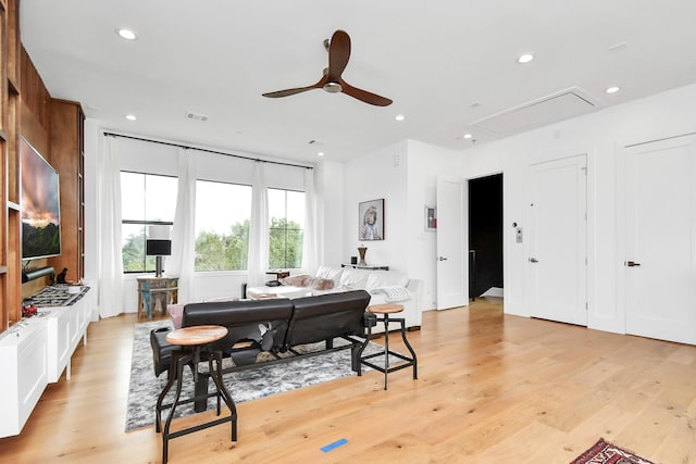 dining space featuring light hardwood / wood-style floors and ceiling fan