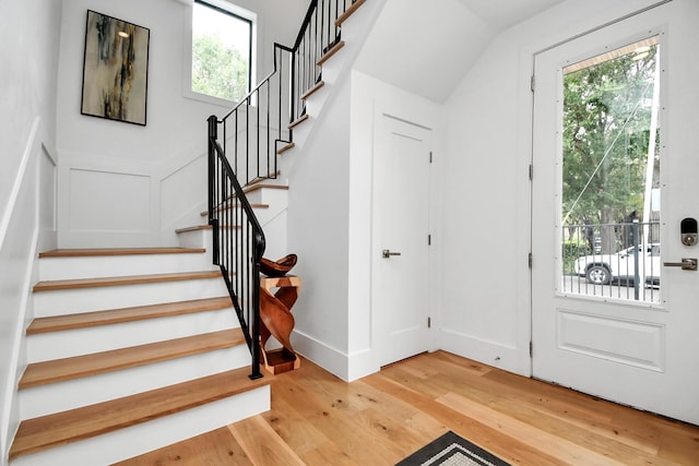 entryway with hardwood / wood-style flooring