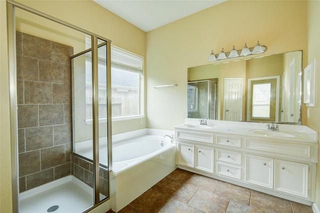 bathroom featuring tile patterned floors, vanity, and plus walk in shower