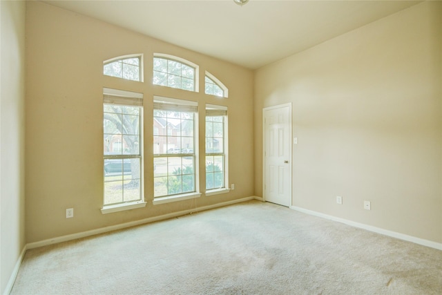 empty room featuring light carpet