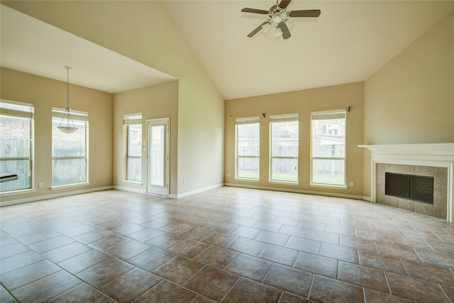 unfurnished living room featuring ceiling fan, a fireplace, and high vaulted ceiling