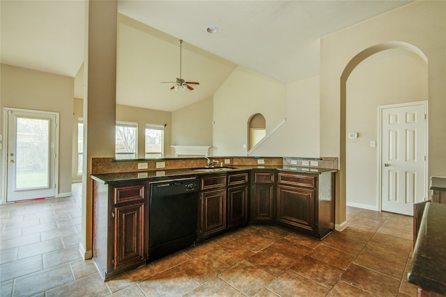 kitchen featuring dark brown cabinetry, ceiling fan, dishwasher, sink, and vaulted ceiling