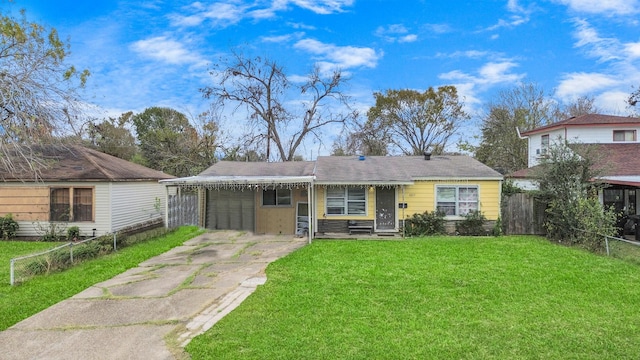 view of front of home with a garage and a front yard