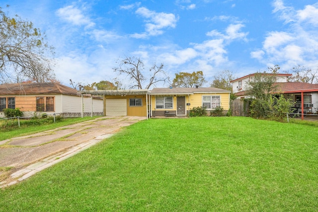 ranch-style home featuring a garage and a front lawn